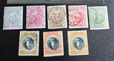 A set of vintage postage stamps from the British Commonwealth, featuring various designs and denominations, arranged in a row.