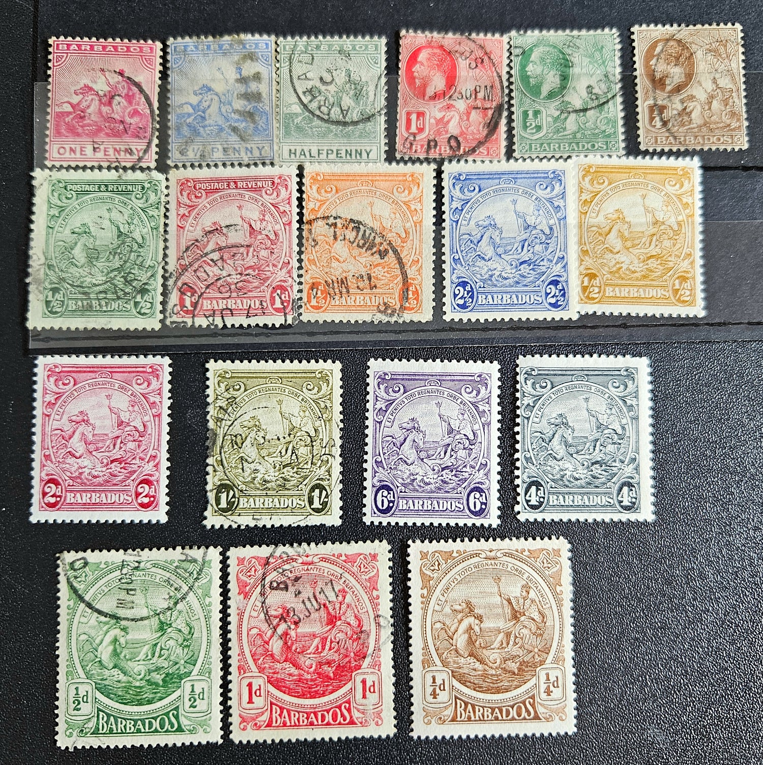 A set of vintage postage stamps from the British Commonwealth, featuring various designs and denominations, arranged in a row.