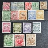 A set of vintage postage stamps from the British Commonwealth, featuring various designs and denominations, arranged in a row.