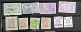 A collection of vintage Indian stamps from various feudatory states including Jhind, Bhopal, Saurashtra, Hyderabad, and Holkar, displayed on a flat surface.