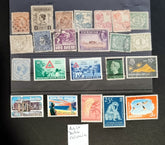 A collection of vintage postage stamps from the Netherlands colonies, featuring various designs and denominations.