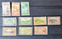 Collection of vintage stamps from Cook Islands on a dark surface
