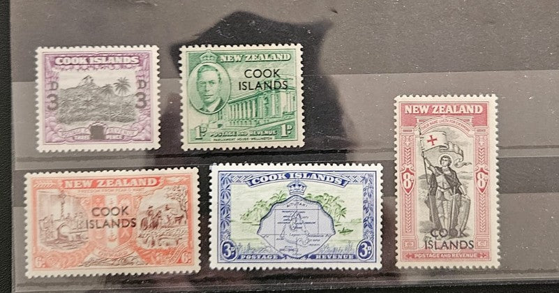 Collection of vintage stamps from New Zealand and Cook Islands on a clear background