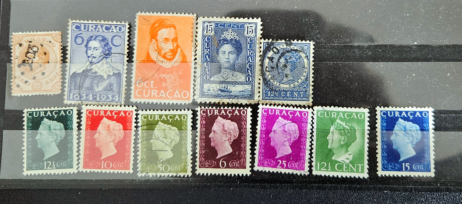 A collection of vintage postage stamps from the Netherlands colonies, featuring various designs and denominations.