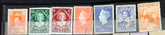 A collection of vintage postage stamps from the Netherlands colonies, featuring various designs and denominations.