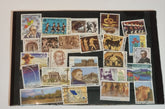 A collection of vintage Greek stamps, featuring different designs and colors, arranged side by side.