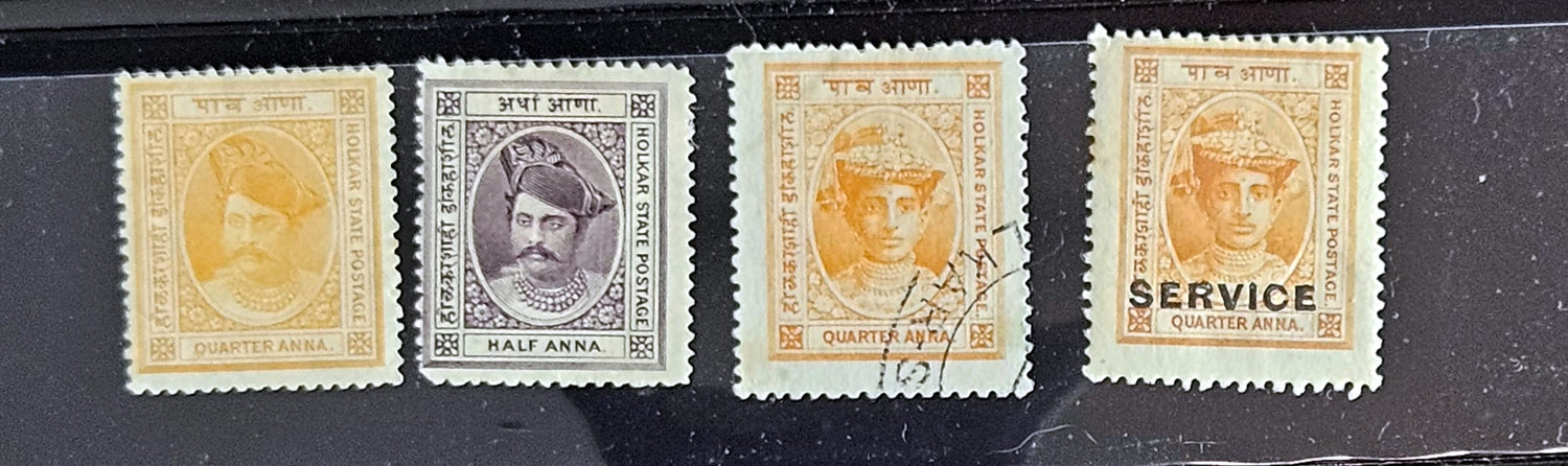 A collection of vintage Indian stamps from various feudatory states including Jhind, Bhopal, Saurashtra, Hyderabad, and Holkar, displayed on a flat surface.
