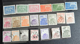 A collection of various Chinese stamps arranged in rows, showcasing different designs and colors.