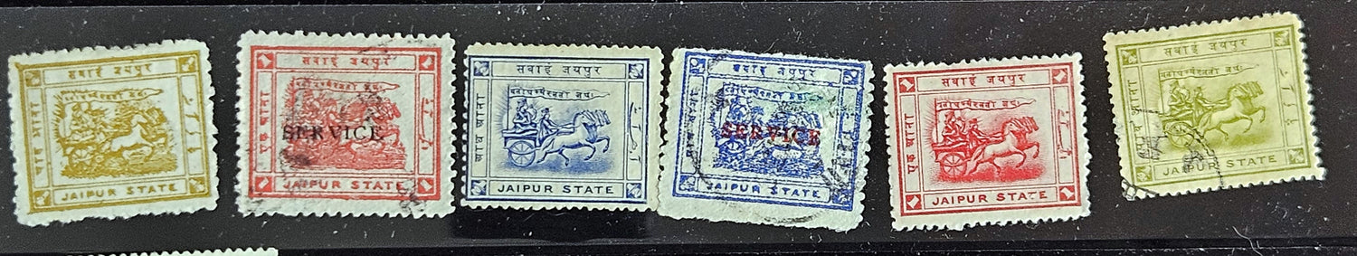 A collection of vintage stamps from Jaipur, India, featuring various designs and denominations, with visible signs of wear.