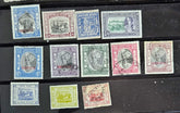 A collection of vintage stamps from Jaipur, India, featuring various designs and denominations, with visible signs of wear.