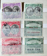 Collection of vintage Dominica stamps with different designs and colors.