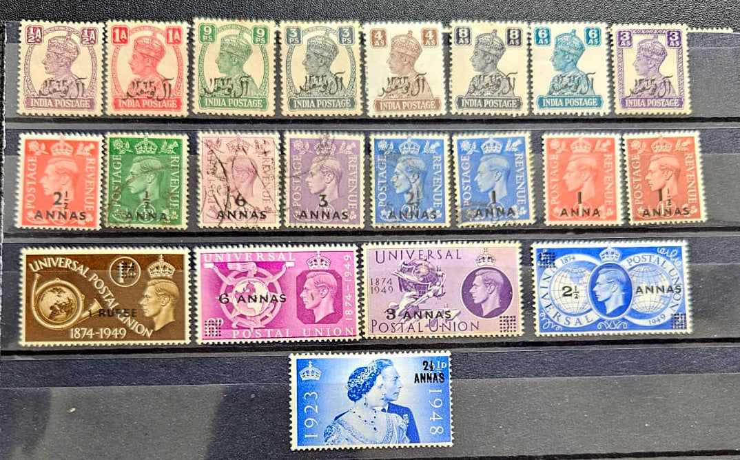 A collection of vintage Muscat Oman postage stamps arranged on a dark stack