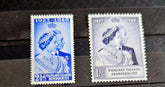 A set of vintage Falkland Islands stamps from various reigns, displayed in a row.