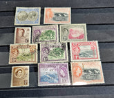 Collection of vintage Dominica stamps on a wooden surface
