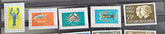 A collection of vintage postage stamps from the Netherlands colonies, featuring various designs and denominations.