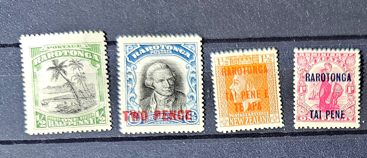Four vintage stamps from Rarotonga on a dark background