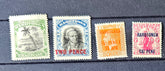 Four vintage stamps from Rarotonga on a dark background