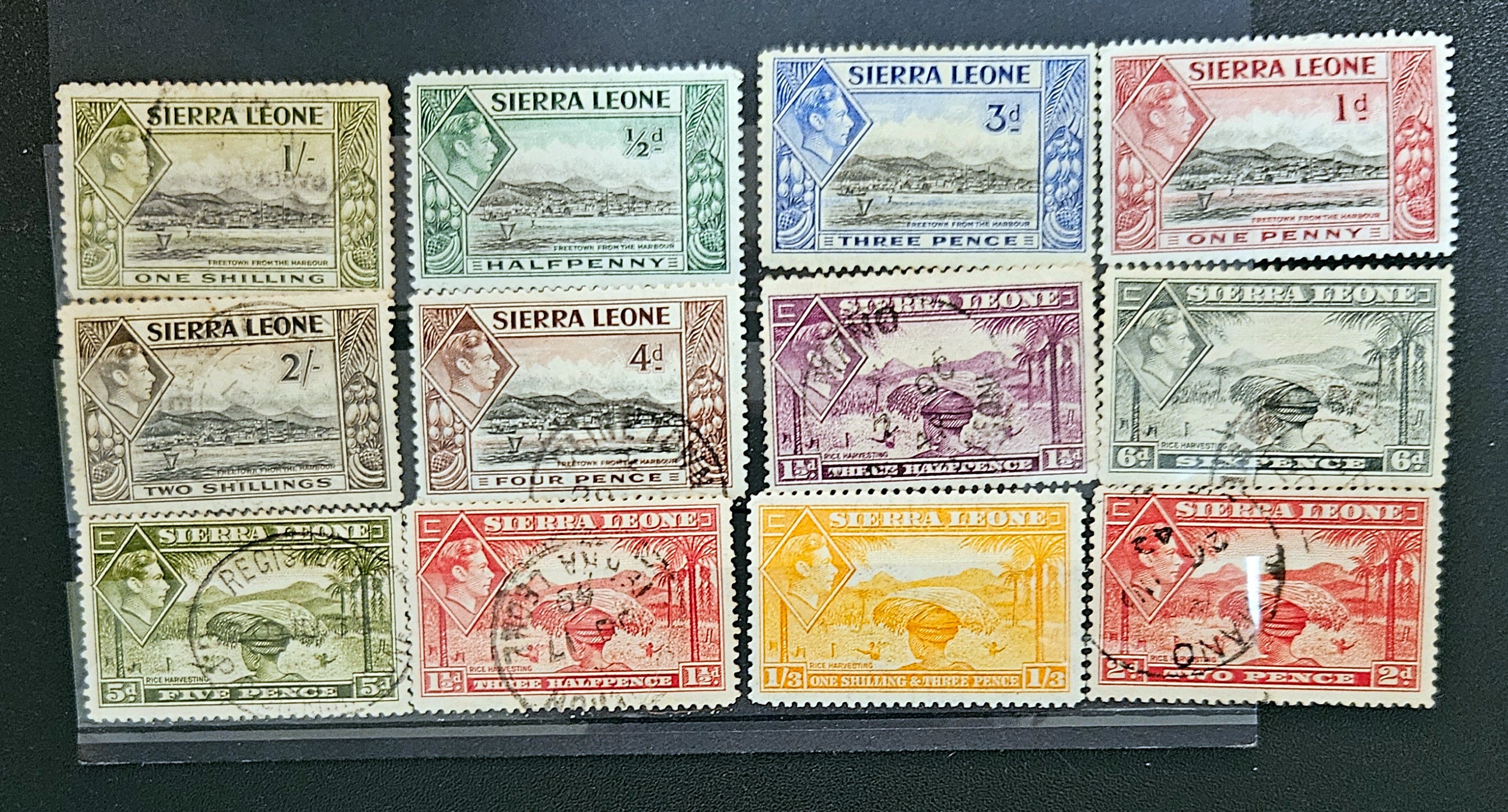 Collection of Sierra Leone stamps displayed on a black background