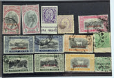 A collection of vintage Indian stamps from various feudatory states including Jhind, Bhopal, Saurashtra, Hyderabad, and Holkar, displayed on a flat surface.