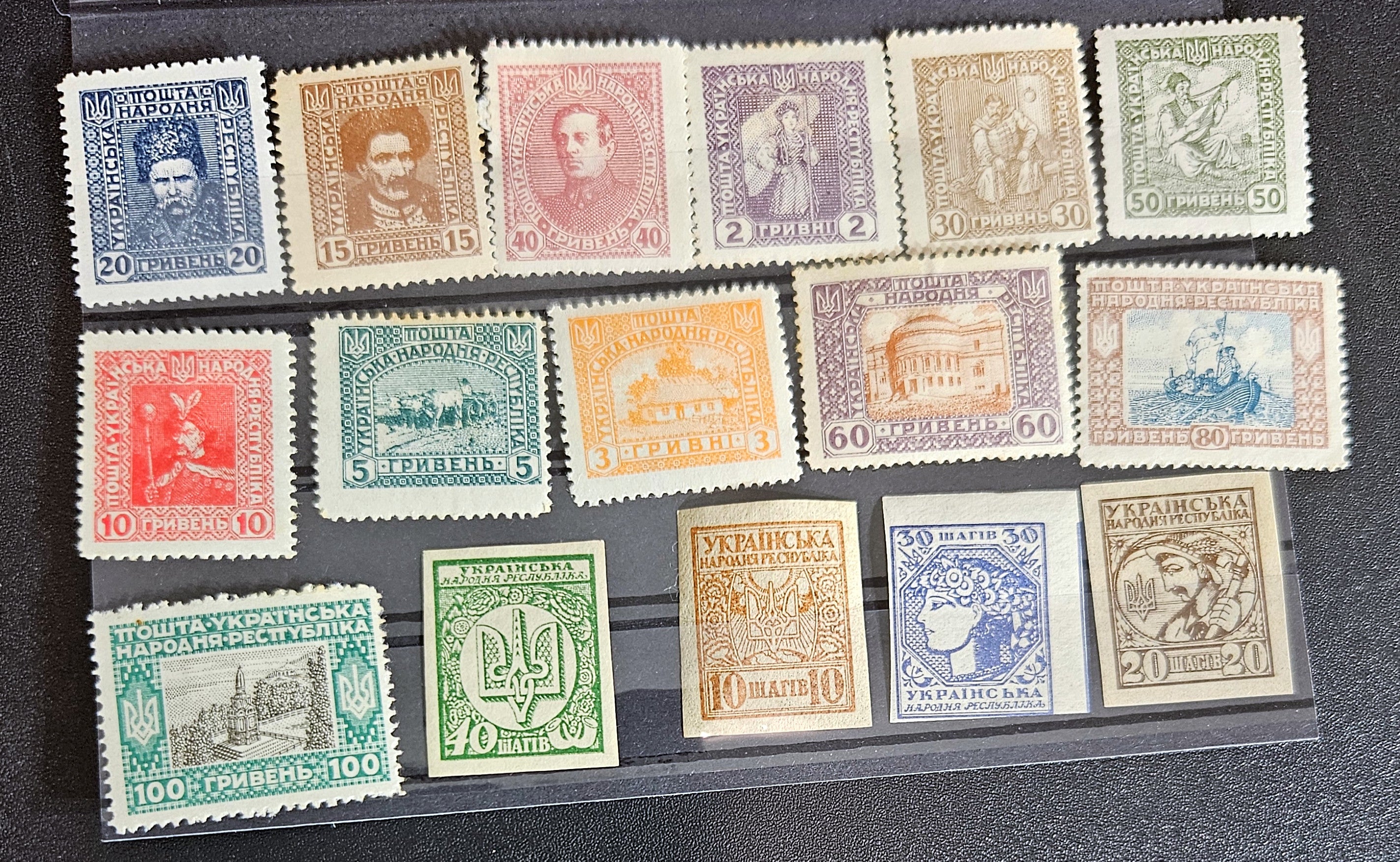 A collection of vintage stamps from Ukraine, showcasing various designs and denominations, displayed on a transparent background.
