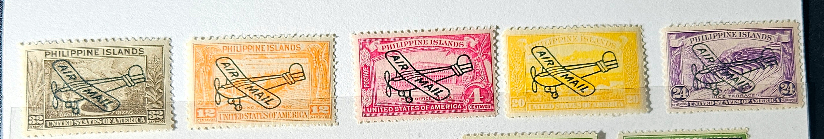 Set of four vintage postage stamps with airplane designs on a textured background.