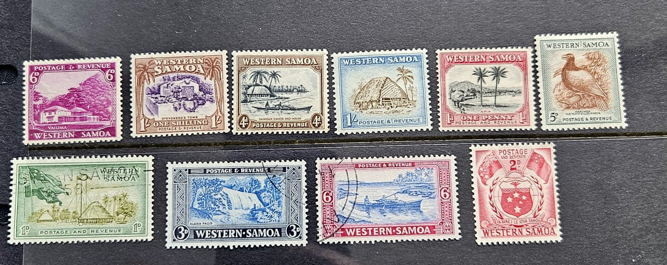 A set of ten vintage Western Samoa postage stamps displayed on a dark textured background, featuring various colors and designs with country names printed on them.