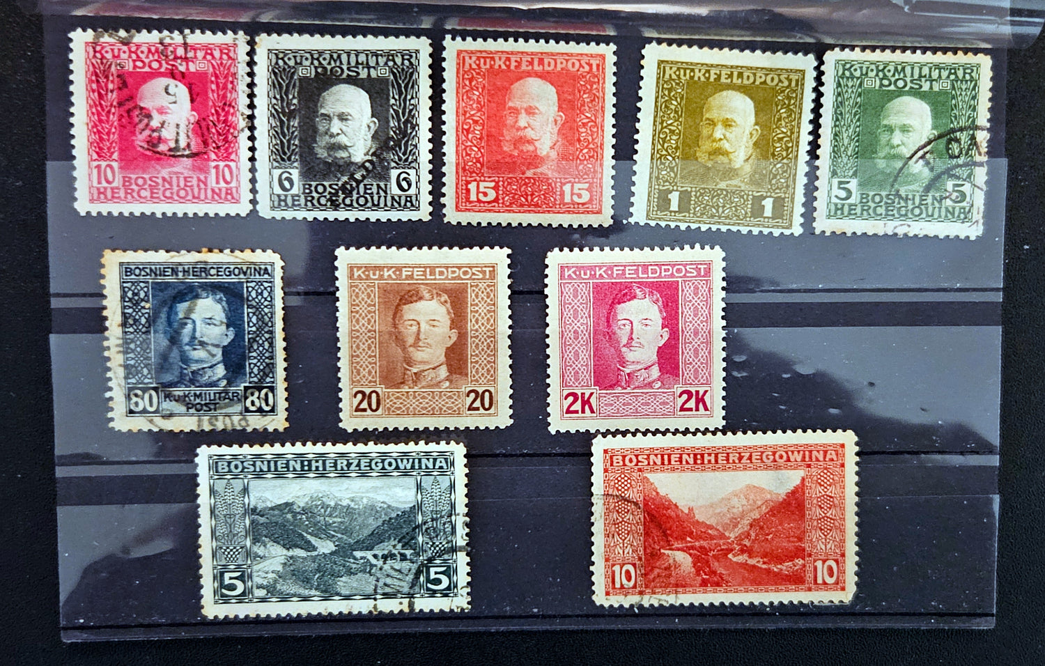 Collection of vintage stamps with different designs and colors on a black background