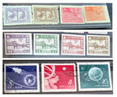 A collection of various Chinese stamps arranged in rows, showcasing different designs and colors.