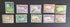 A collection of vintage postage stamps from the Netherlands colonies, featuring various designs and denominations.