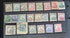A collection of vintage postage stamps from various German colonies, featuring different colors and designs, arranged in a row on a white background.
