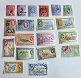 A collection of vintage Commonwealth British Honduras stamps from various reigns, displayed on a white background.