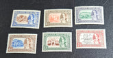 A collection of vintage stamps from Jaipur, India, featuring various designs and denominations, with visible signs of wear.