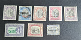 A collection of vintage stamps from Jaipur, India, featuring various designs and denominations, with visible signs of wear.