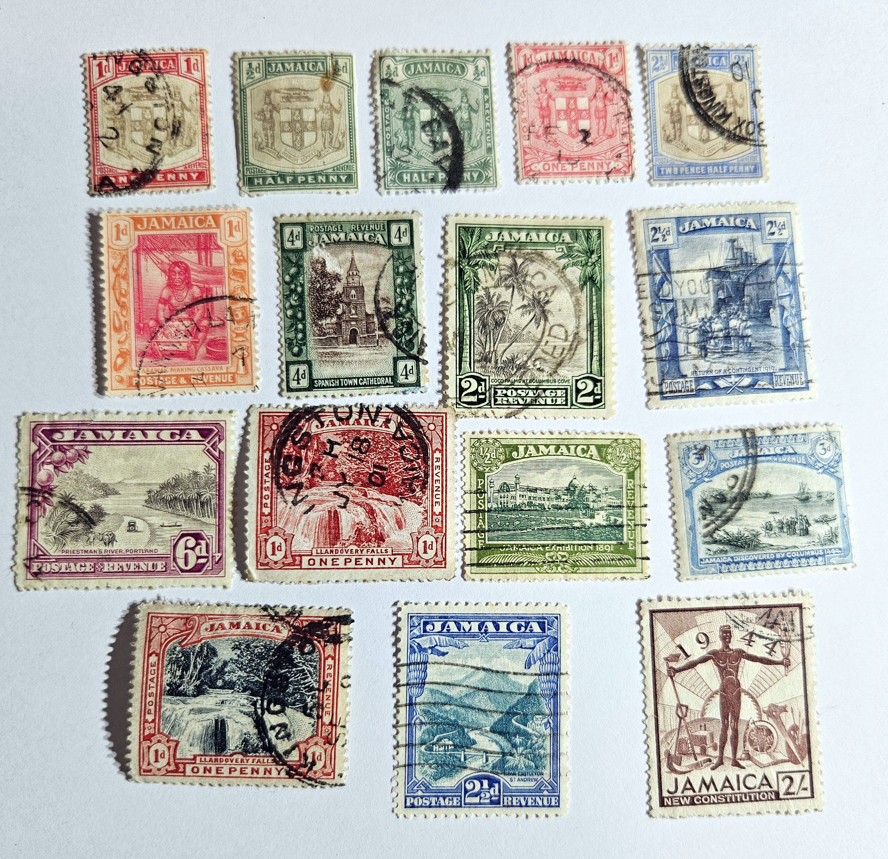 A collection of vintage Jamaica stamps from various reigns of British monarchs, displayed on a black background.