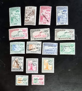 A collection of vintage Zanzibar stamps with various colors and designs, displayed horizontally.