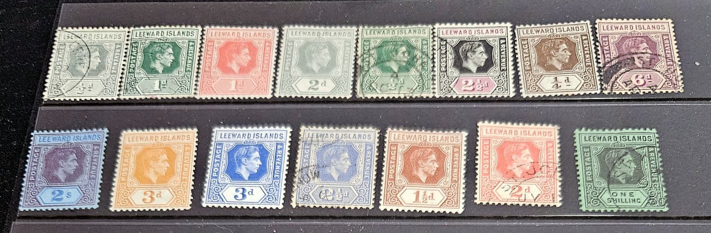 Authentic vintage Leeward Islands postage stamps archive featuring various royal eras by StampArtefact.