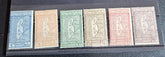 A set of vintage postage stamps from OLTRE GIUBA JUBALAND in various colors displayed on a flat surface.