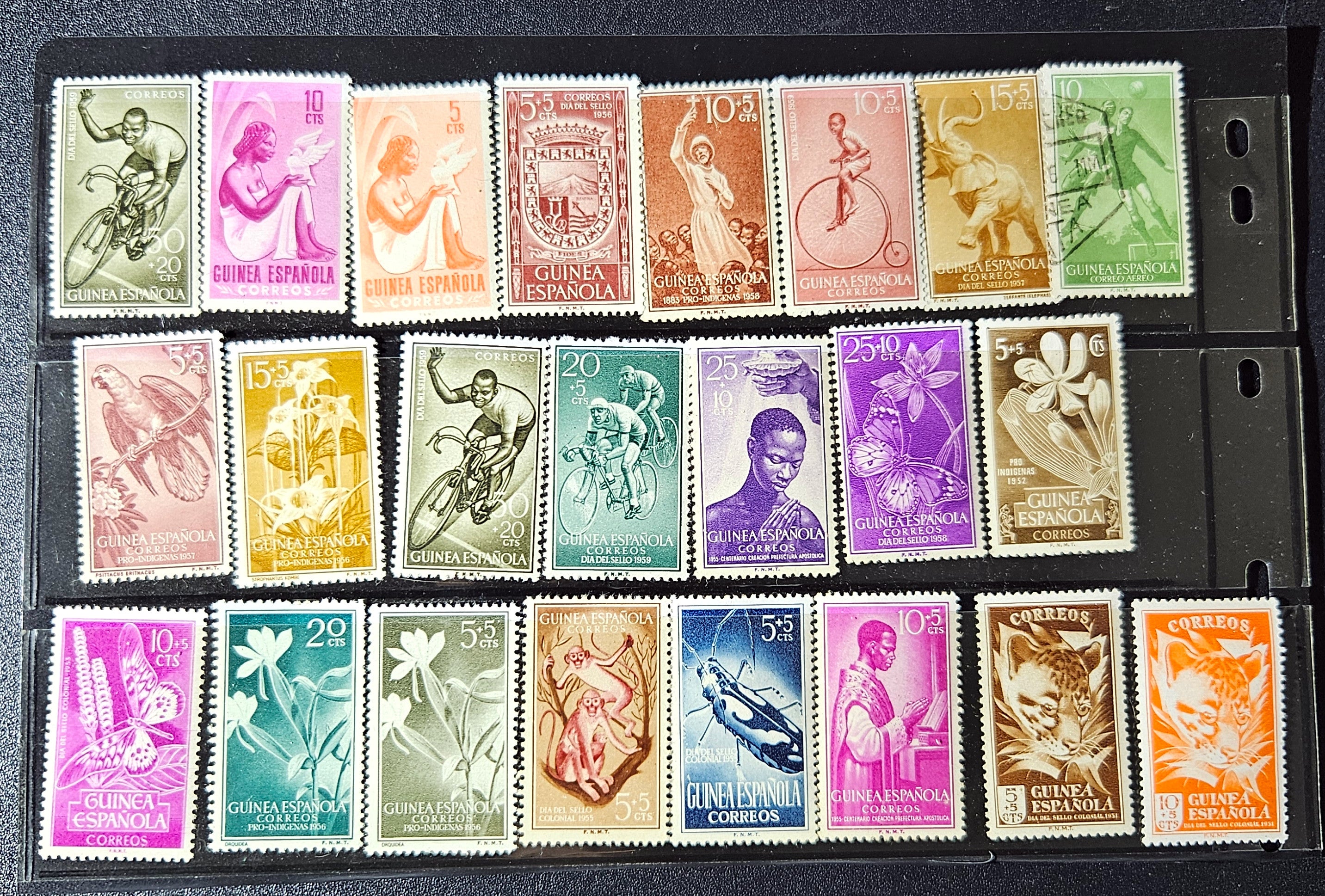 Collection of vintage stamps with various designs and colors arranged in a grid.