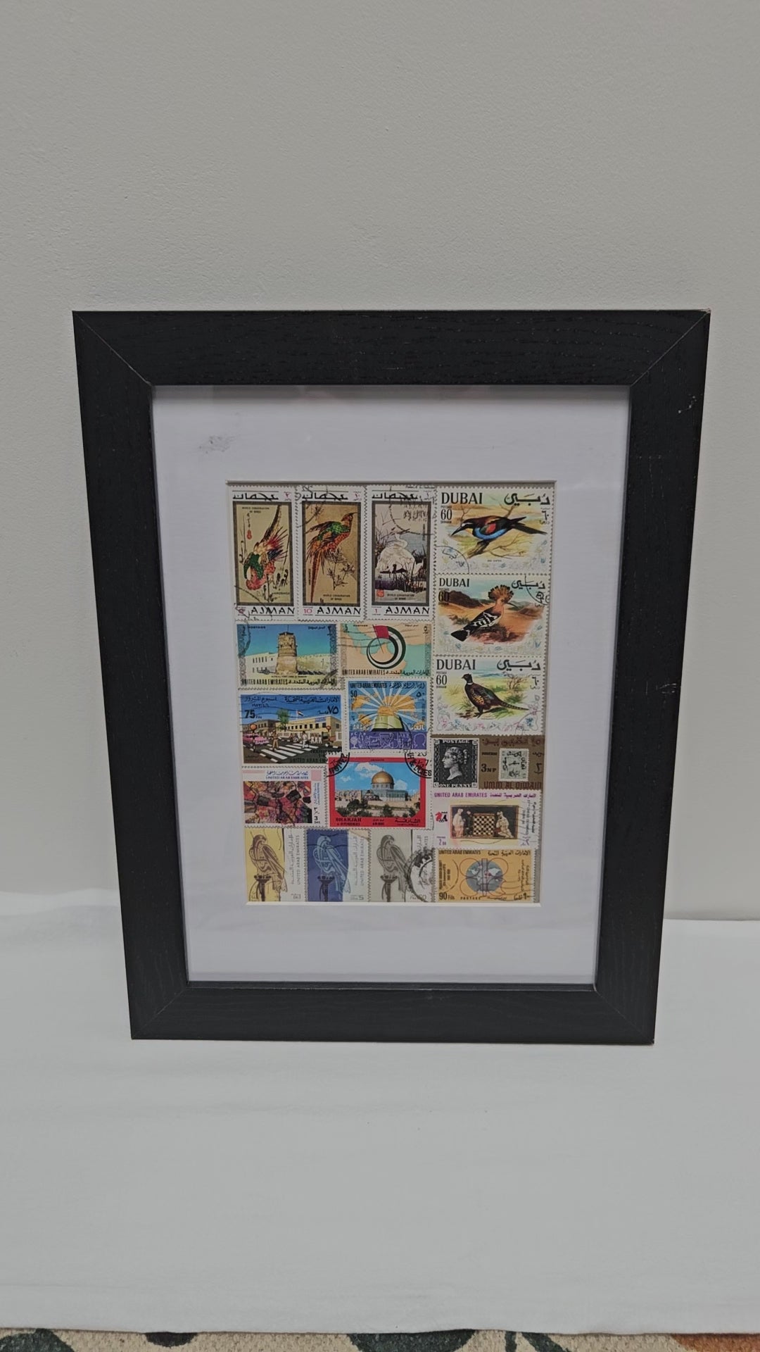 Framed collage of postage stamps with &
