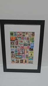 Framed collage of various Arab postage stamps with a black frame.