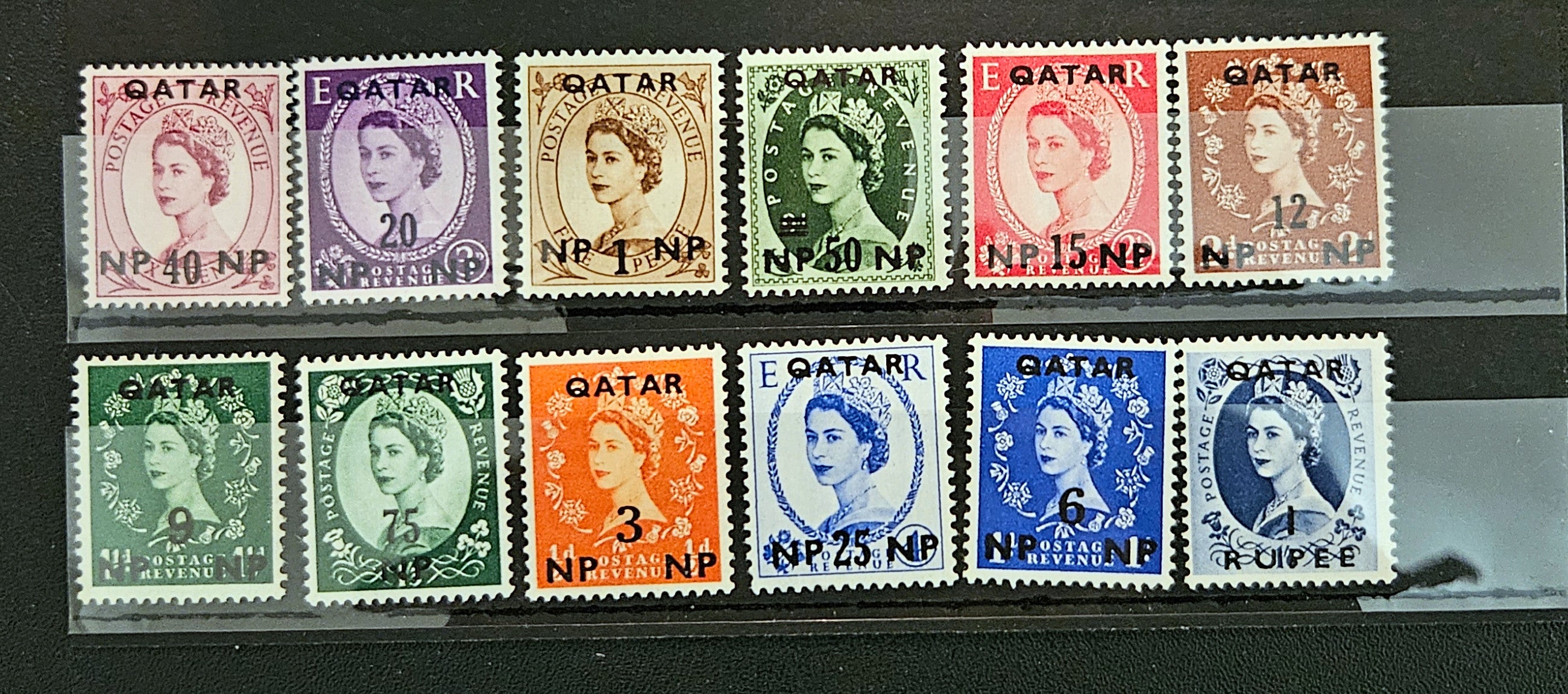 Collection of stamps with Queen Elizabeth II on a display slide