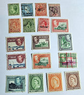 A collection of vintage St. Vincent postage stamps featuring various portraits of monarchs, denomination markings, and cancelation lines.