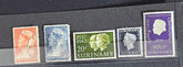 A collection of vintage postage stamps from the Netherlands colonies, featuring various designs and denominations.