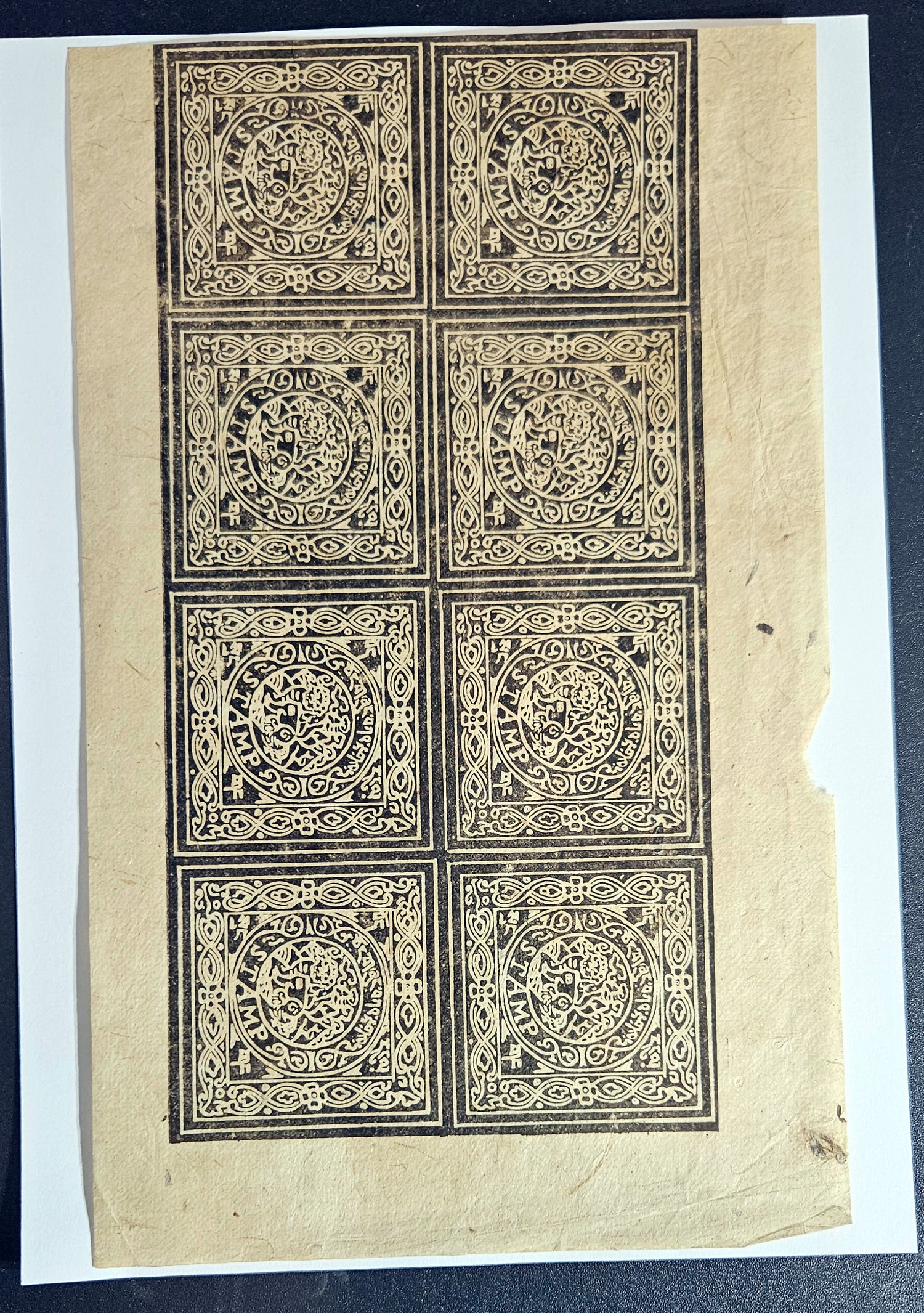 A sheet of vintage Tibet revenue stamps featuring intricate black patterns.