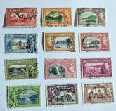 A collection of vintage Trinidad and Tobago stamps showcasing various colors and designs, featuring historical figures and landscapes.