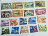 A collection of vintage Trinidad and Tobago stamps from the British Commonwealth era, displaying various colors and designs.