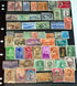 A collection of various Indian postage stamps displayed in a fanned out arrangement, showcasing different colors and designs with various images, including historical figures and national symbols.