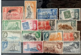 A set of vintage postage stamps from the British Commonwealth, featuring various designs and denominations, arranged in a row.