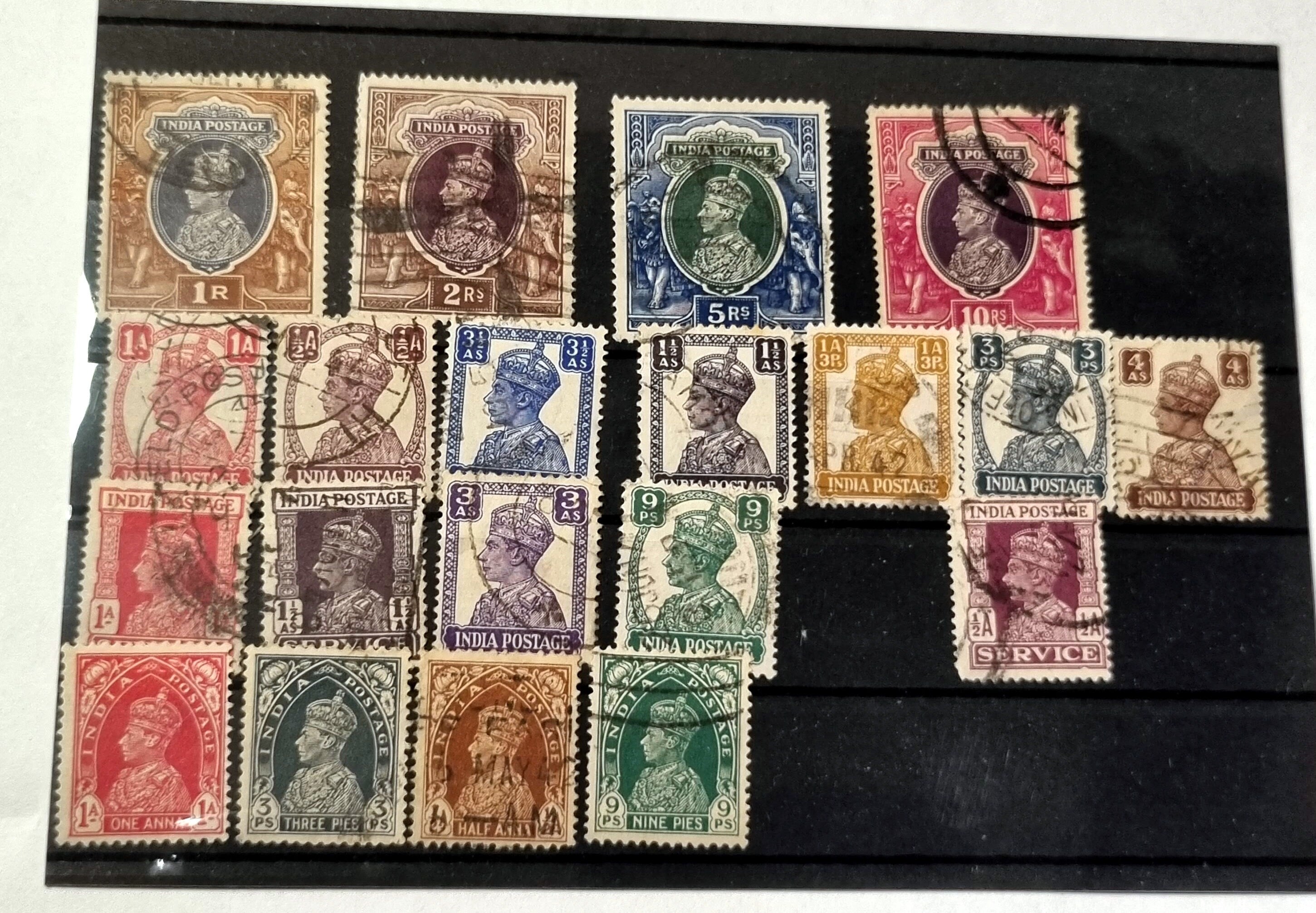 A selection of vintage India stamps from various regions and periods, displayed in a row.