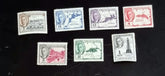A collection of vintage postage stamps from the British Virgin Islands, featuring various designs and Queen Elizabeth II.
